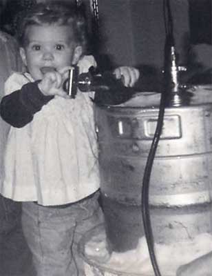 little girl with a beer keg