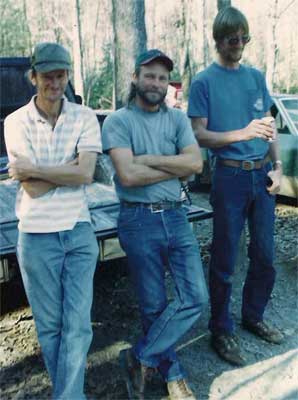 Three men in blue jeans