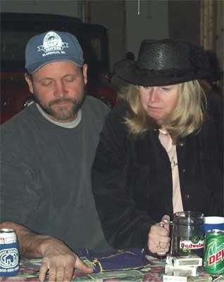 man and woman playing poker