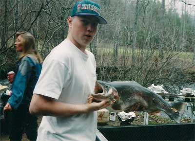 Man with fish at Trout Camp in the North Georgia Mountains