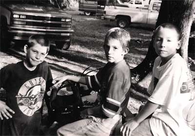 Three boys at teh End of the Pavement