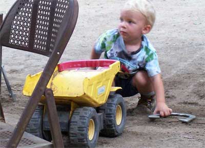Little boy with dump truck