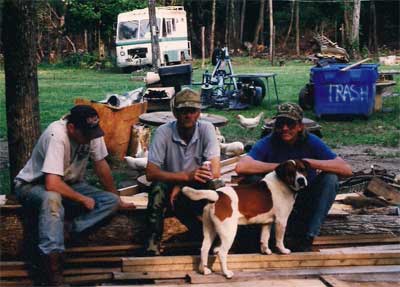 three men with a dog