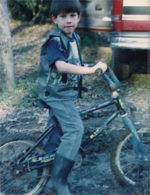 Caleb rides a bike