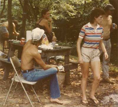 People gather around the picnic table