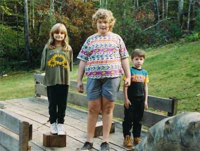 three kids in a wagon