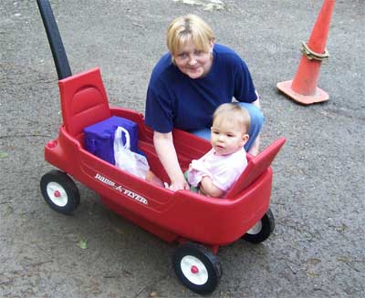 baby in red wagon