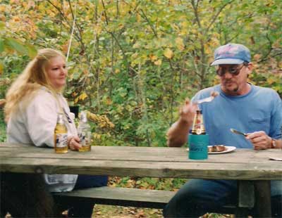 girl and man at picnic table