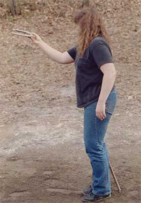 Diane prepares to throw a horseshoe.