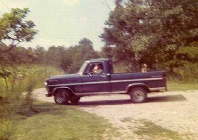 Al rides in the back of a truck