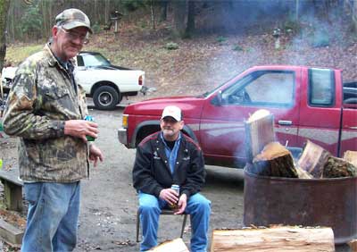 standing by a burn barrel