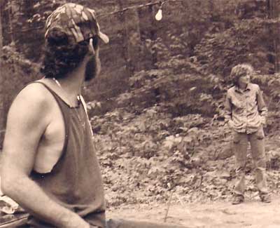 Man, woman, and the horseshoe pits