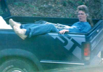 Gwen riding in back of pickup