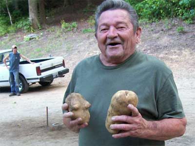 Harold with his home grown potatoes