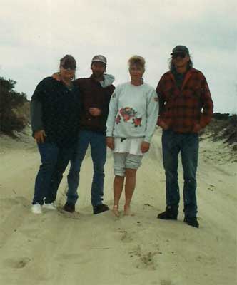 four friends in the sand