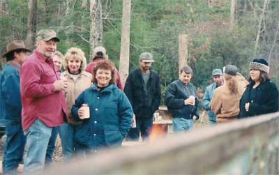 People enjoy the horseshoe tournament