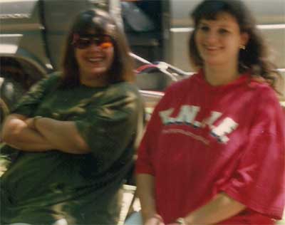 two women in green and red