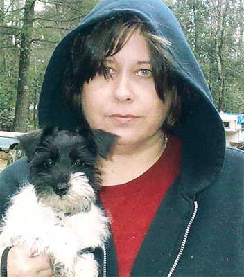 woman with a schnauzer puppy