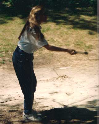 Jill prepares to throw a horseshoe.