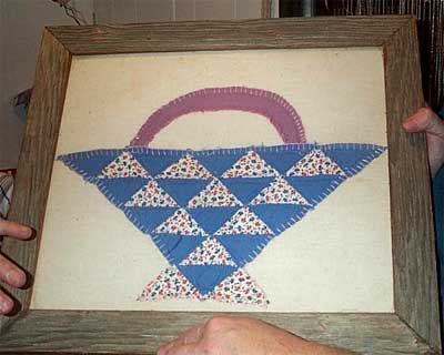 old quilt square in frame