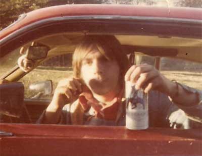 Ronnie with a beer sitting in his truck