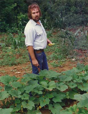 man picks squash