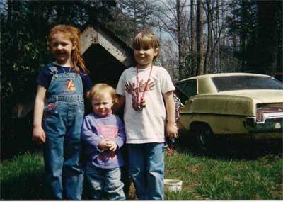 three girls and a dog house