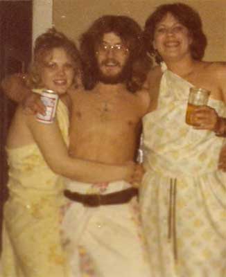 man with two women at Toga Party