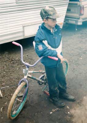 Boy with bicycle at Trout Camp in the North Georgia Mountains