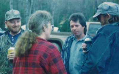 Three men and a woman at Trout Camp in the North Georgia Mountains