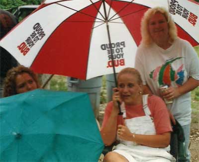 three women with umbrellas