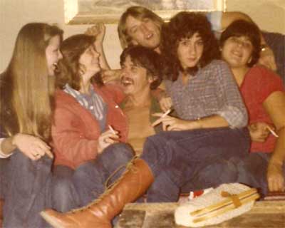 A lucky man on couch with women